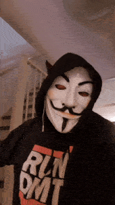 a person wearing a mask and a run dmt hoodie