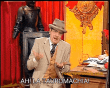 a man in a suit and tie says ahi la tauromachia