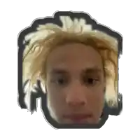a close up of a man 's face with blonde hair and a black frame around it .