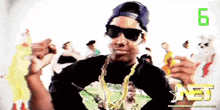 a man wearing sunglasses and a black shirt with a n3 logo