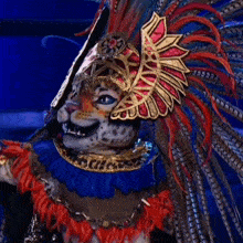 a leopard costume with feathers and a crown