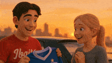 a man wearing a red shirt that says hogwarts holds a blue shirt