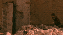 a person is standing in front of a huge fireball