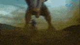 a blurry picture of a dinosaur with the gma logo in the corner