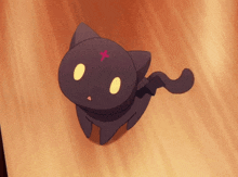 a black cat with a red cross on it 's head
