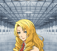 a woman with blonde hair and blue eyes is standing in a large warehouse
