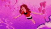a girl in a red shirt is swimming in a purple water