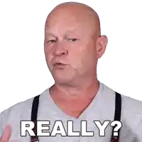 a bald man wearing suspenders and a grey shirt says really