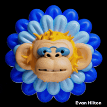 a picture of a monkey surrounded by blue balloons with the name evan hilton underneath it