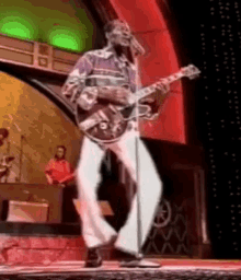 Chuck Berry GIF - Chuck Berry Guitar Dance GIFs