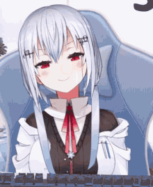 a girl with white hair and red eyes is sitting in a chair