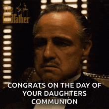 a man in a tuxedo is congratulating his daughters communion
