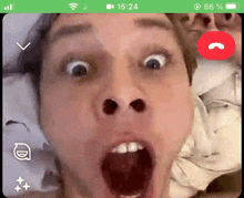 a man is making a funny face while talking on a video call