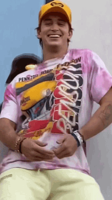 a man wearing a pink pennzoil johnson shirt