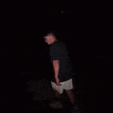 a blurry picture of a person walking with a flashlight