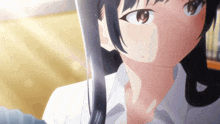 a close up of a girl with long black hair