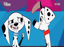 two dalmatian dogs standing next to each other on a disney channel advertisement