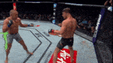 two men are fighting in a ring with a metropcs banner