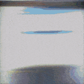 a blurry picture of a person 's face with a blue and white stripe