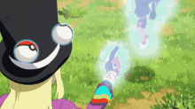 a person wearing a top hat and a rainbow colored shirt is pointing at another person