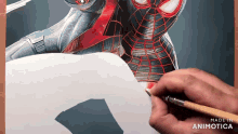 a person is drawing a spiderman with a pencil on a piece of paper made in animatica