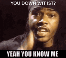 a man with a bandana on his head is saying " you down wit ist "