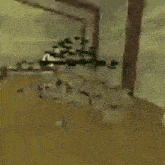 a blurry picture of a room with a ceiling fan in the background