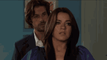 a man and a woman with their eyes closed