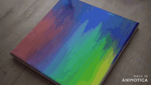 a painting of a rainbow is being made in animatica
