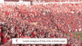 a large crowd of people watching a soccer game with a banner that says liverpool
