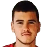 a man with a beard and a red shirt is looking at the camera on a white background .