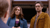 a man and a woman standing next to each other
