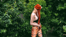 a woman wearing a tiger hat and leggings