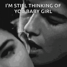 a black and white photo of a man and woman kissing with a caption that says i 'm still thinking of you baby girl