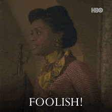 a woman with the word foolish written on the bottom of her face