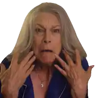 a woman with gray hair and a ring on her finger is making a funny face