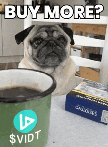 a pug dog is sitting next to a cup of coffee and a box of gauloises cigarettes