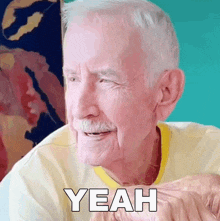 an elderly man is smiling and saying yeah .