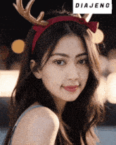 a woman wearing a headband with antlers and the word diajeng on it