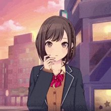 a girl in a school uniform with a red bow is standing in front of a building .