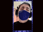 a picture of a man wearing headphones and a mask that says starmaker on the bottom