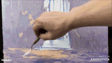 a hand is holding a brush in front of a painting that is made in animatica