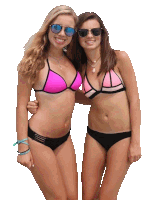 two women in bikinis pose for a picture with one wearing sunglasses