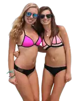 two women in bikinis pose for a picture with one wearing sunglasses