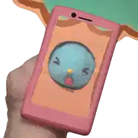 a hand is holding a pink cell phone with a blue face on the screen