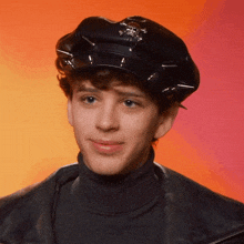 a young man wearing a police hat and turtleneck