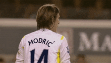 a soccer player with the name modric on his back
