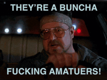 a man driving a car with the words " they 're a buncha fucking amateurs "
