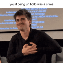 a man with his hands on his chest with the words you if being un bollo was a crime