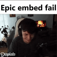 a man wearing headphones is smiling in front of a fireplace with the words epic embed fail displayed
